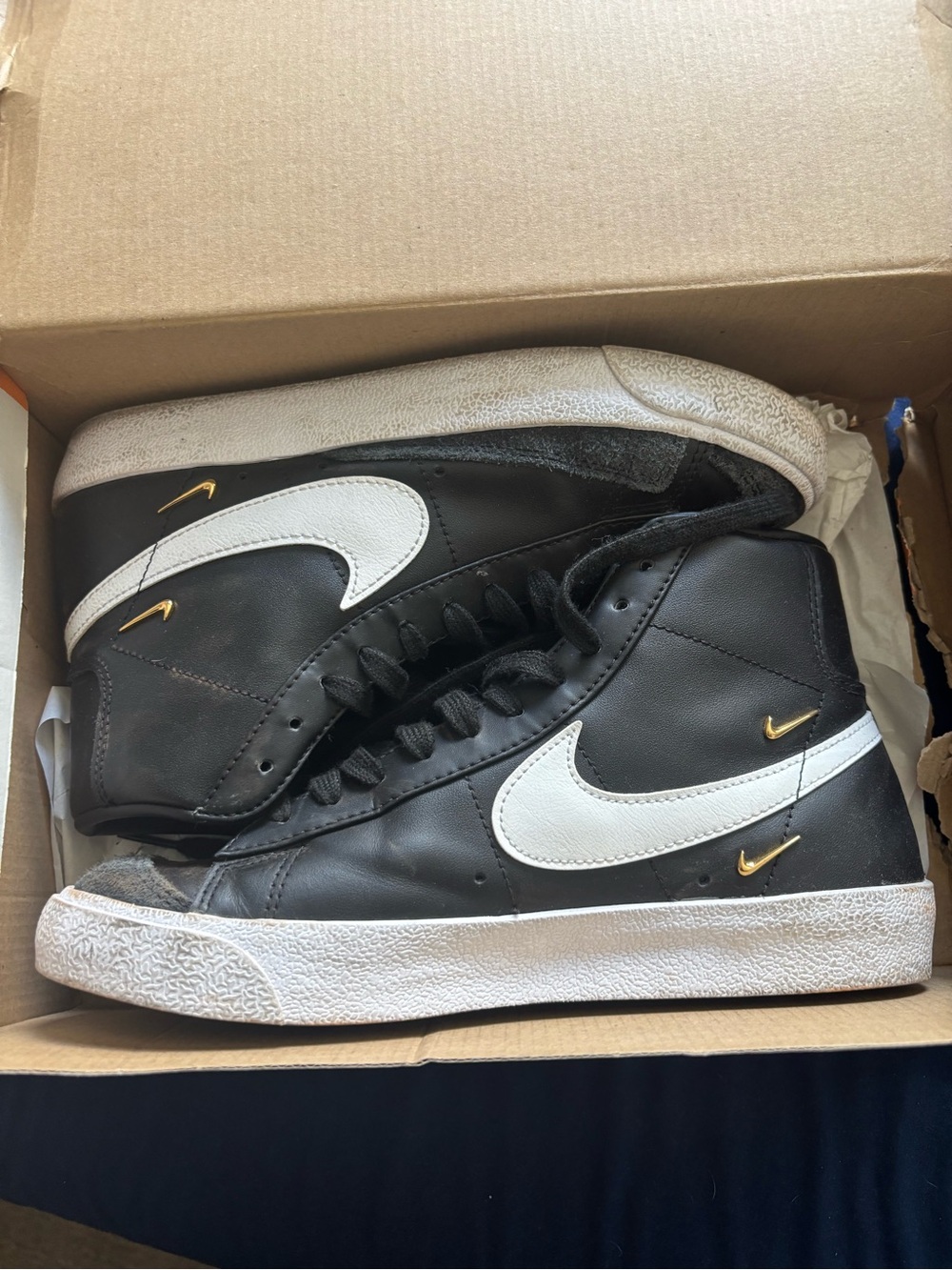 Nike Black & White High-Top Sneakers with Gold Swoosh Accents